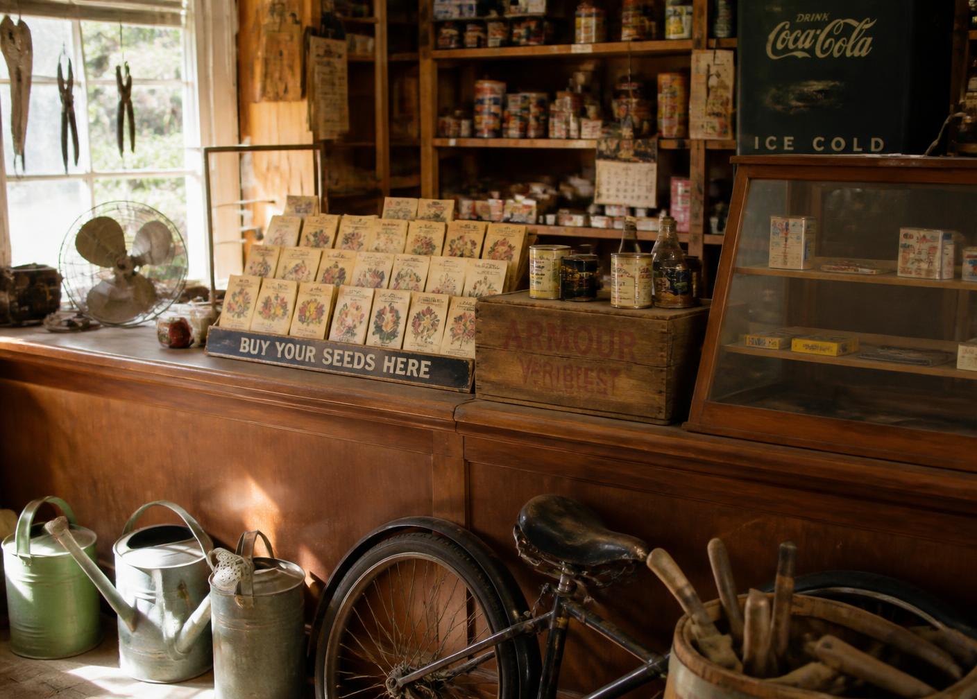 Vintage general store counter with seed packets and watering cans